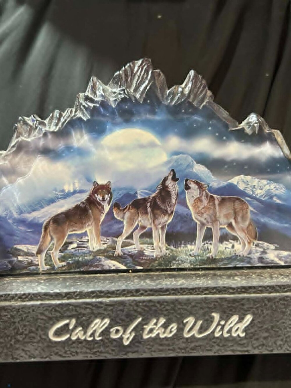 The Bradford Exchange  "Call of the Wild" a wolf-themed collector item.